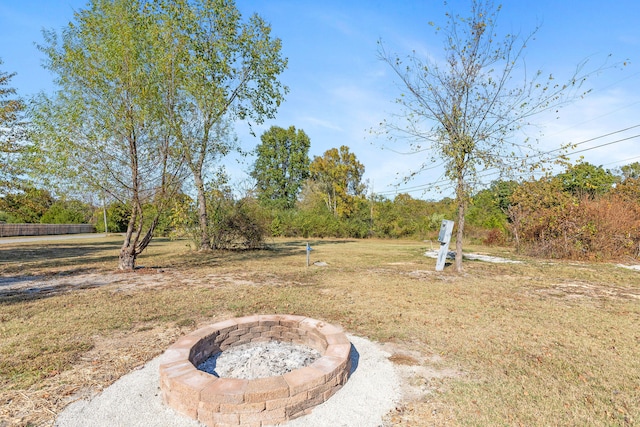 view of yard with an outdoor fire pit