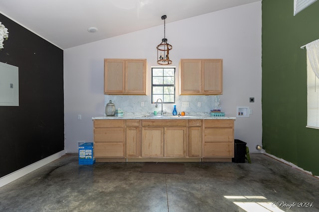 kitchen featuring lofted ceiling, decorative light fixtures, tasteful backsplash, and light brown cabinets