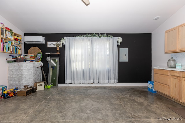 garage featuring electric panel and a wall mounted air conditioner