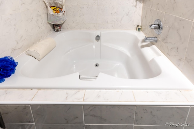 bathroom featuring tiled bath