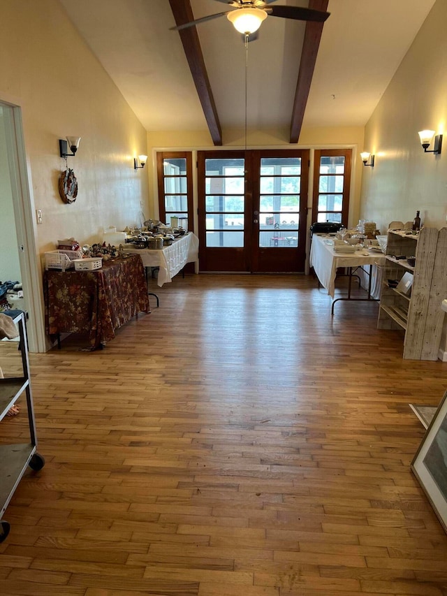 living room with ceiling fan, vaulted ceiling with beams, french doors, and wood-type flooring