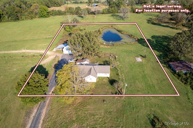 bird's eye view with a water view and a rural view