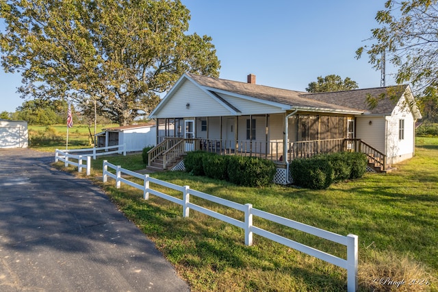 view of front of home featuring a front yard and a porch