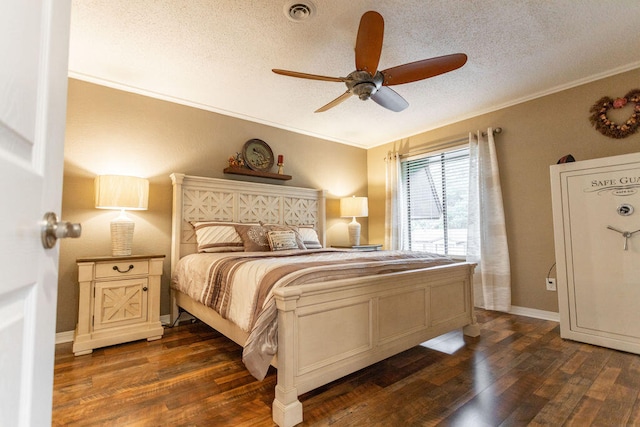 bedroom featuring ornamental molding, ceiling fan, a textured ceiling, and dark hardwood / wood-style flooring