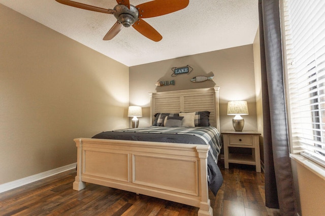 bedroom with a textured ceiling, ceiling fan, vaulted ceiling, and dark hardwood / wood-style flooring