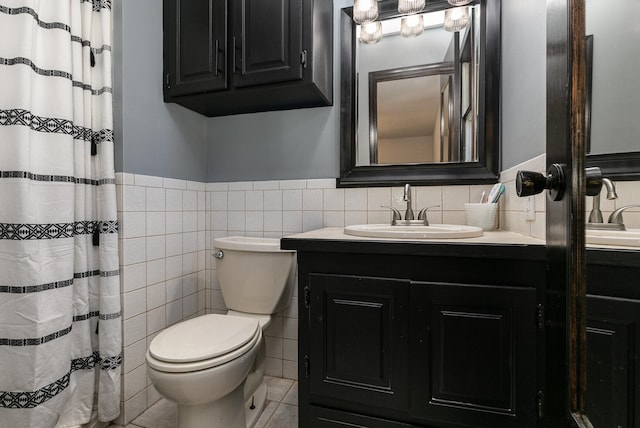 bathroom featuring vanity, tile walls, tile patterned flooring, curtained shower, and toilet