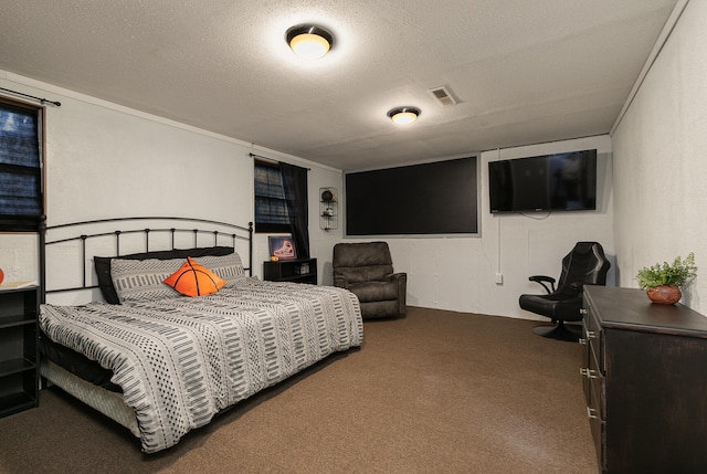 bedroom featuring carpet flooring and a textured ceiling