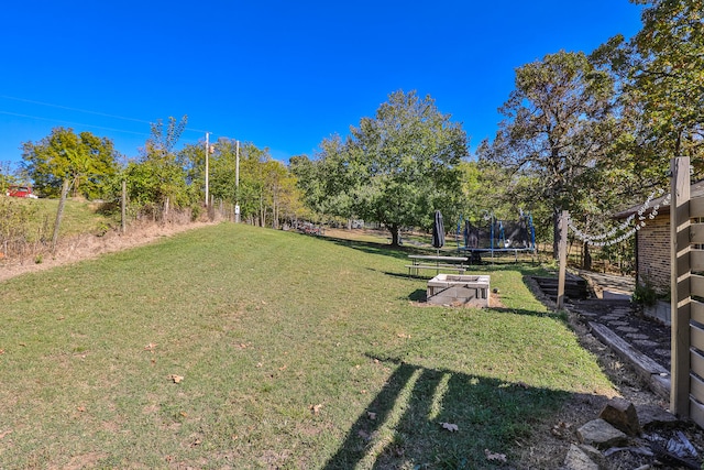 view of yard featuring a trampoline