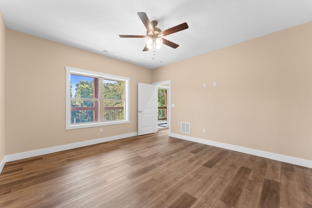 unfurnished room featuring hardwood / wood-style flooring and ceiling fan