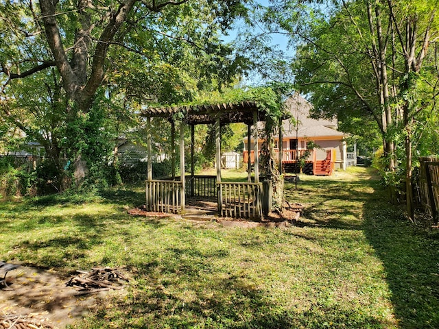 view of yard featuring a pergola and a deck