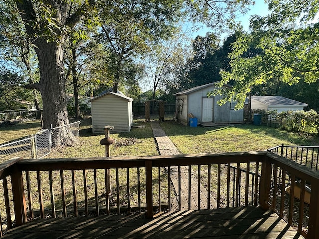 wooden deck featuring a yard and a shed