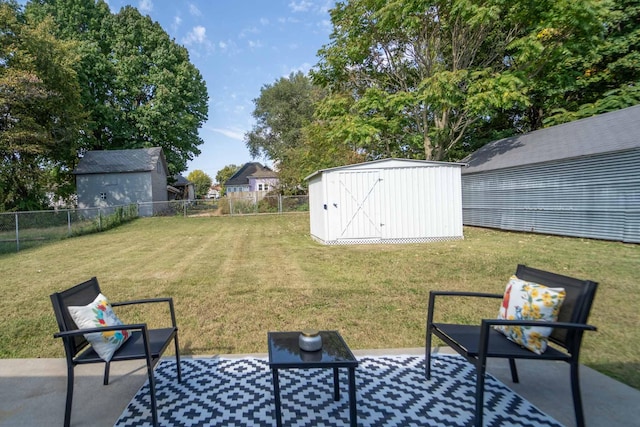 view of yard featuring a shed and a patio