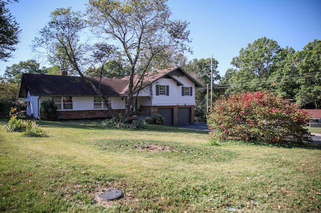 exterior space with a garage and a front lawn