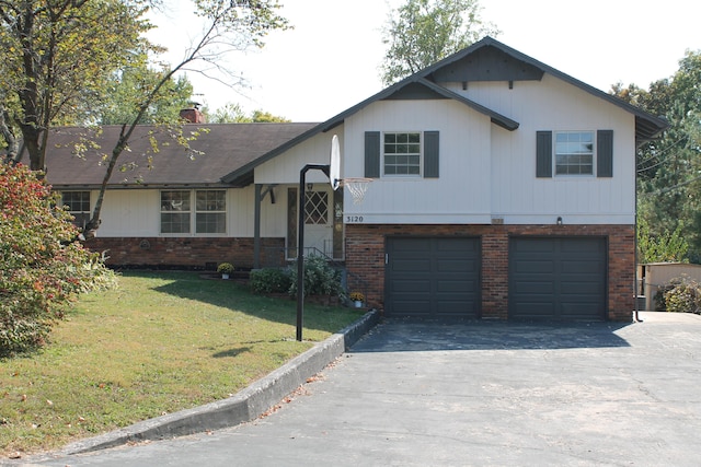 tri-level home with a garage and a front lawn