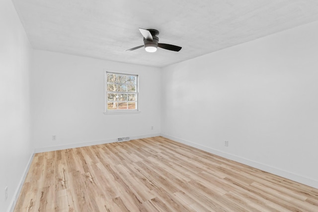 empty room with ceiling fan and light wood-type flooring