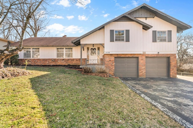 tri-level home with a garage and a front yard