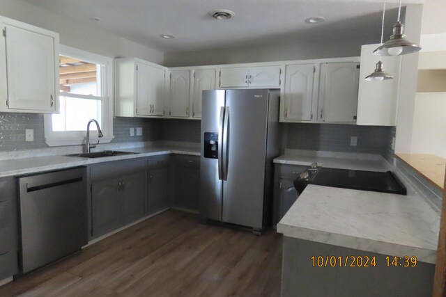 1504 S 14th Ave, Ozark, MO 65721 - kitchen featuring appliances with stainless steel finishes, dark wood-style floors, decorative backsplash, and a sink