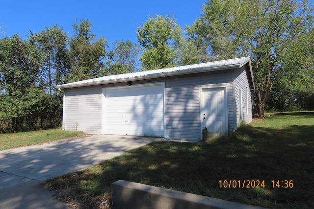 garage featuring a yard