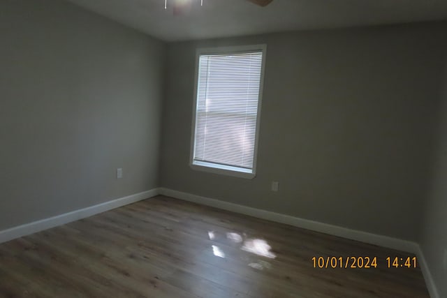 1504 S 14th Ave, Ozark, MO 65721 - spare room featuring wood finished floors, baseboards, and ceiling fan