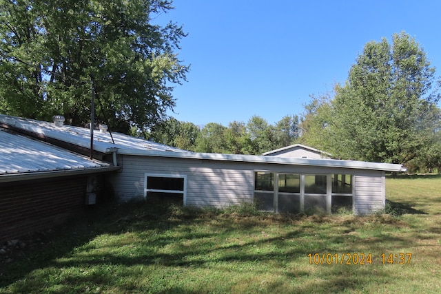 view of property exterior featuring a yard