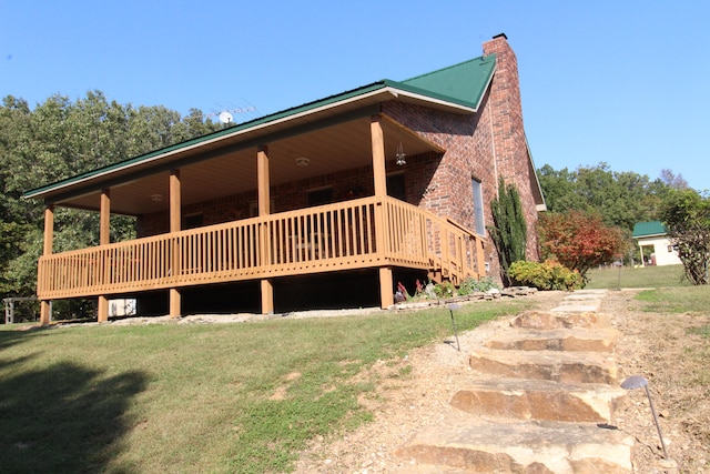 exterior space featuring a yard and a deck