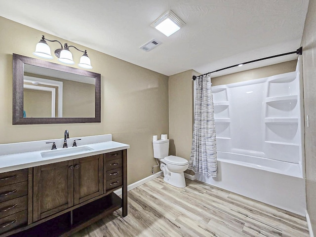 full bathroom featuring shower / tub combo with curtain, wood-type flooring, vanity, and toilet