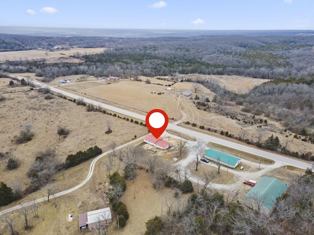 birds eye view of property featuring a rural view