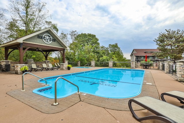 view of pool featuring a gazebo and a patio