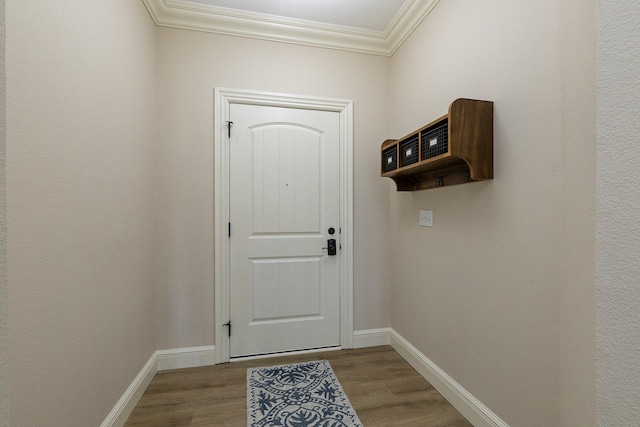 doorway to outside featuring light wood-type flooring and ornamental molding