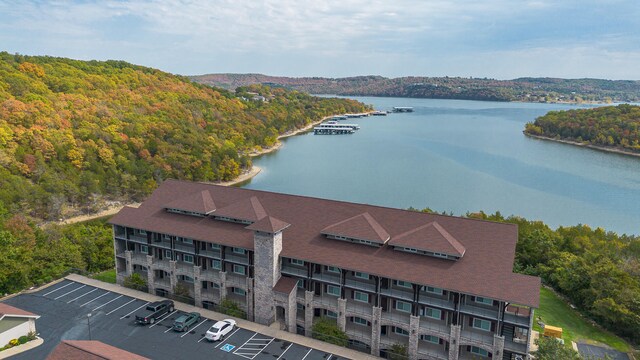 birds eye view of property with a water view