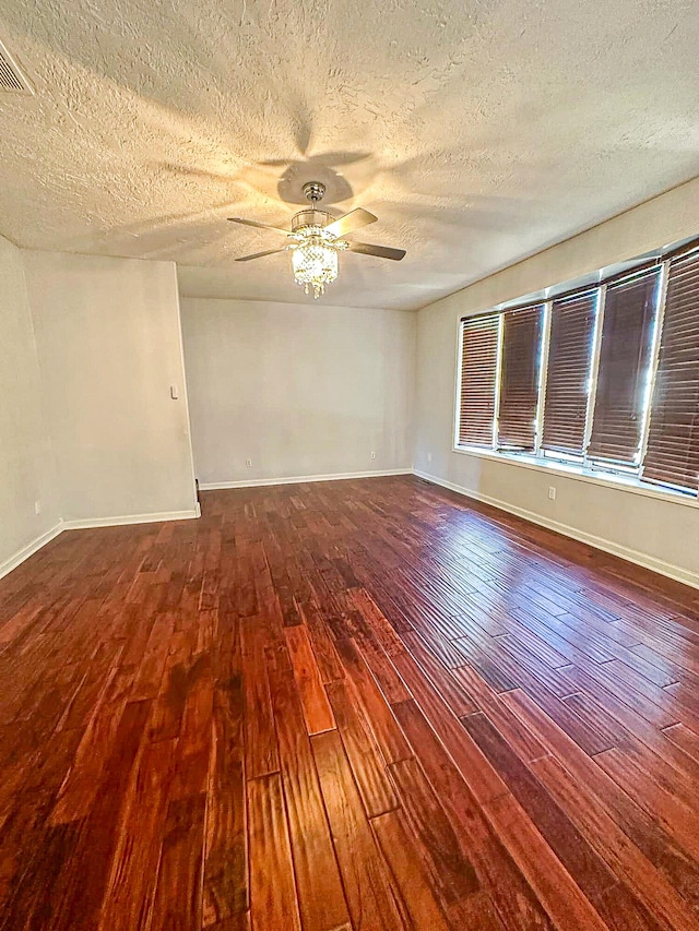 unfurnished room featuring wood-type flooring, ceiling fan, and a textured ceiling