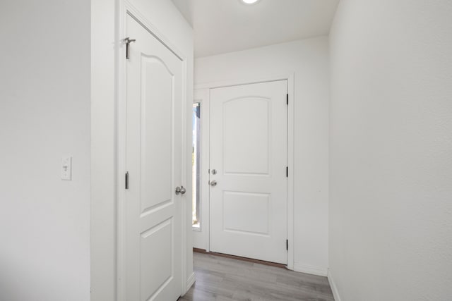 corridor featuring light hardwood / wood-style floors