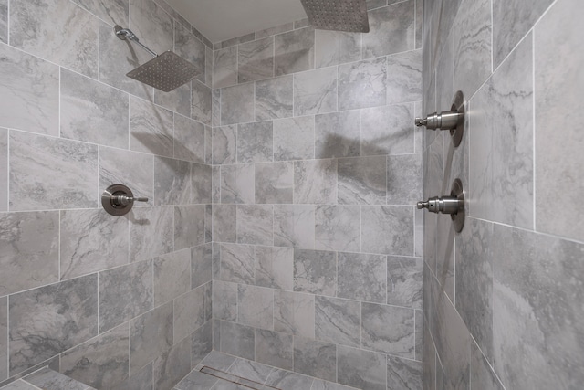 bathroom with a tile shower