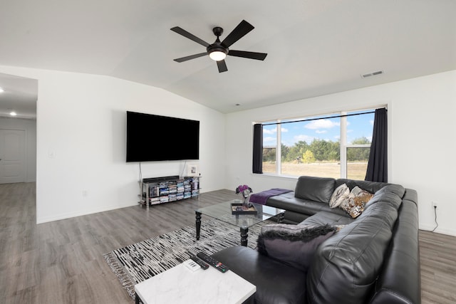 living room featuring ceiling fan, lofted ceiling, and hardwood / wood-style floors