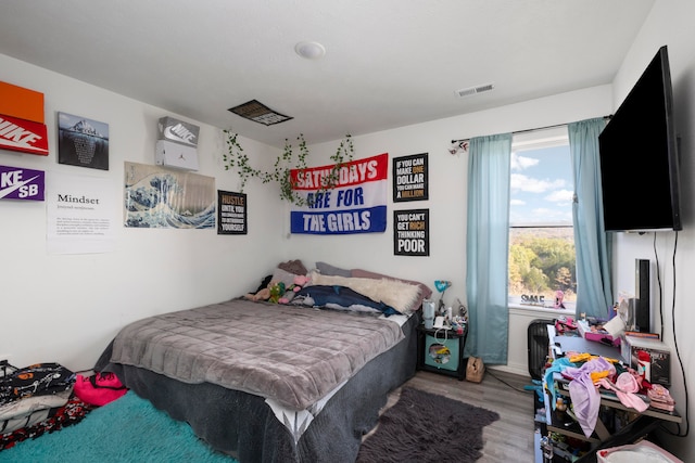 bedroom featuring wood-type flooring