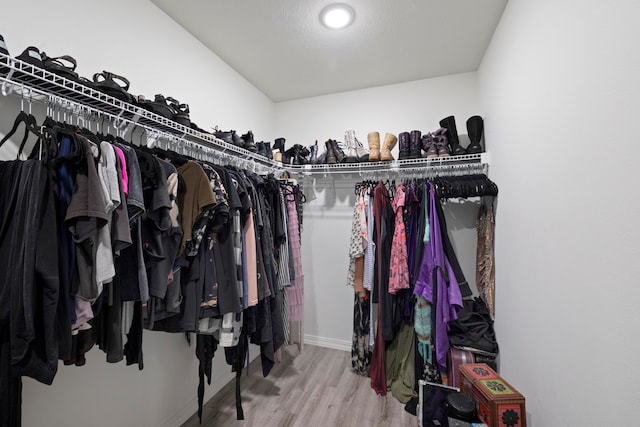 walk in closet featuring hardwood / wood-style floors