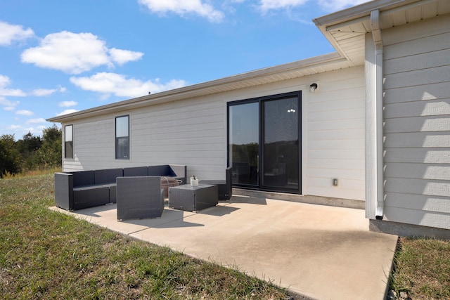 back of house with outdoor lounge area and a patio area