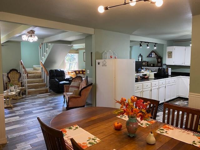 dining space with dark wood-type flooring