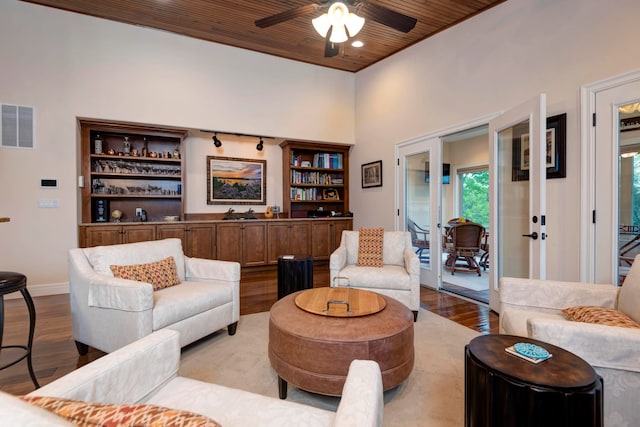 living room featuring ceiling fan, french doors, wooden ceiling, built in features, and light hardwood / wood-style flooring