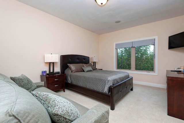 bedroom featuring light colored carpet