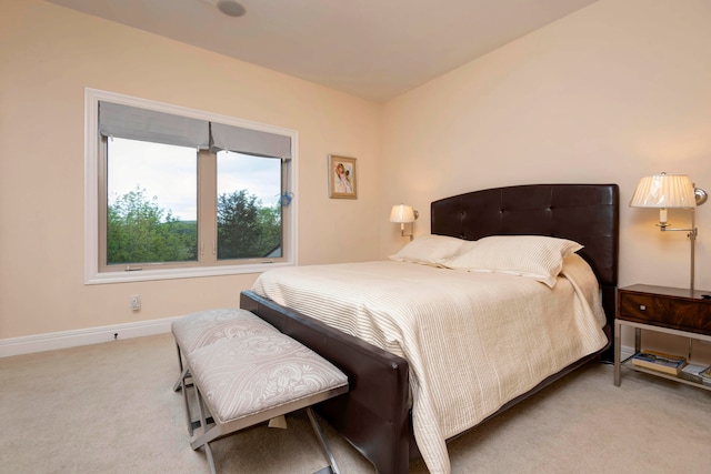 bedroom featuring light carpet