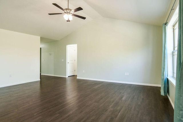 spare room featuring lofted ceiling, dark hardwood / wood-style flooring, and ceiling fan