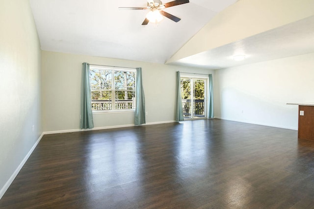 empty room featuring ceiling fan, dark hardwood / wood-style flooring, and a healthy amount of sunlight