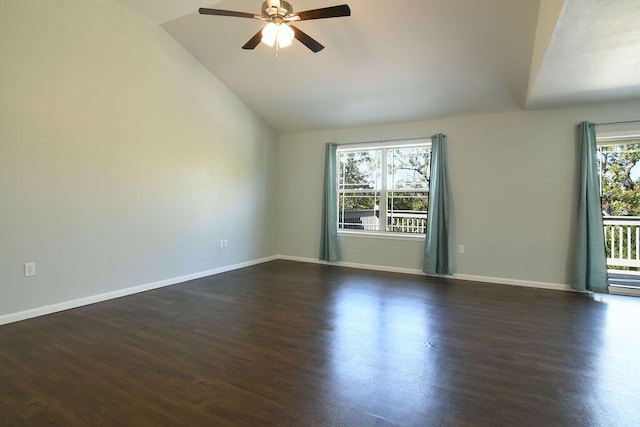 spare room featuring ceiling fan, vaulted ceiling, and dark hardwood / wood-style floors