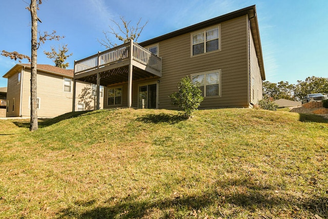 rear view of house featuring a lawn