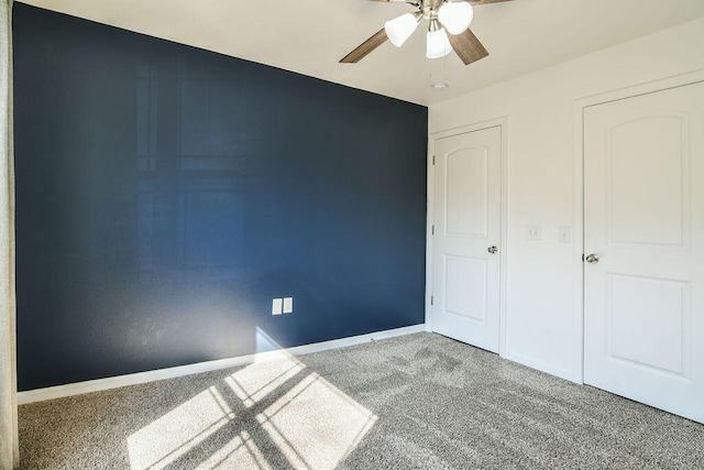 unfurnished bedroom featuring carpet flooring and ceiling fan