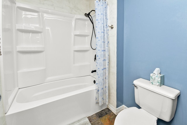 bathroom with shower / bath combo with shower curtain and toilet