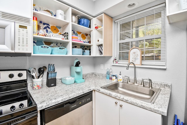 kitchen featuring light stone counters, sink, white cabinetry, dishwasher, and electric range