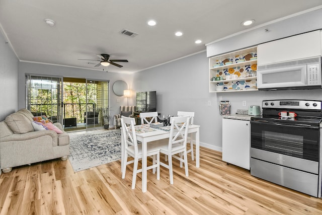 kitchen featuring ceiling fan, white cabinets, light hardwood / wood-style floors, ornamental molding, and stainless steel range with electric stovetop