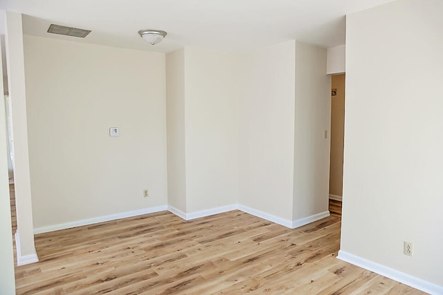 empty room with light hardwood / wood-style floors